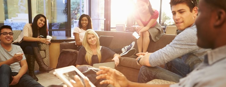 students discussing the university's new AI agent in a relaxed setting