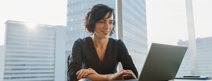 woman-banker-working-with-ai-agent-on-laptop