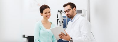 woman and doctor discussing tablet AI Agent automation