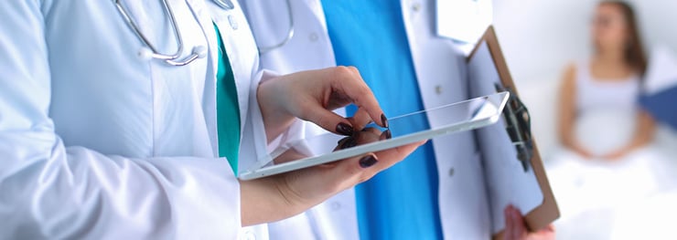 Medical professional working with autonomous agent over handheld device