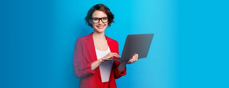 Happy-woman-learning-about-building-ai-agents-for-beginners-on-laptop