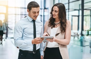 woman broker showing various AI agent recommendations to potential client on tablet