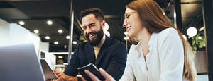 woman-and-man-using-ai-agent-on-cell-phones